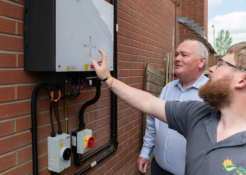 Installer and homeowner with battery storage.