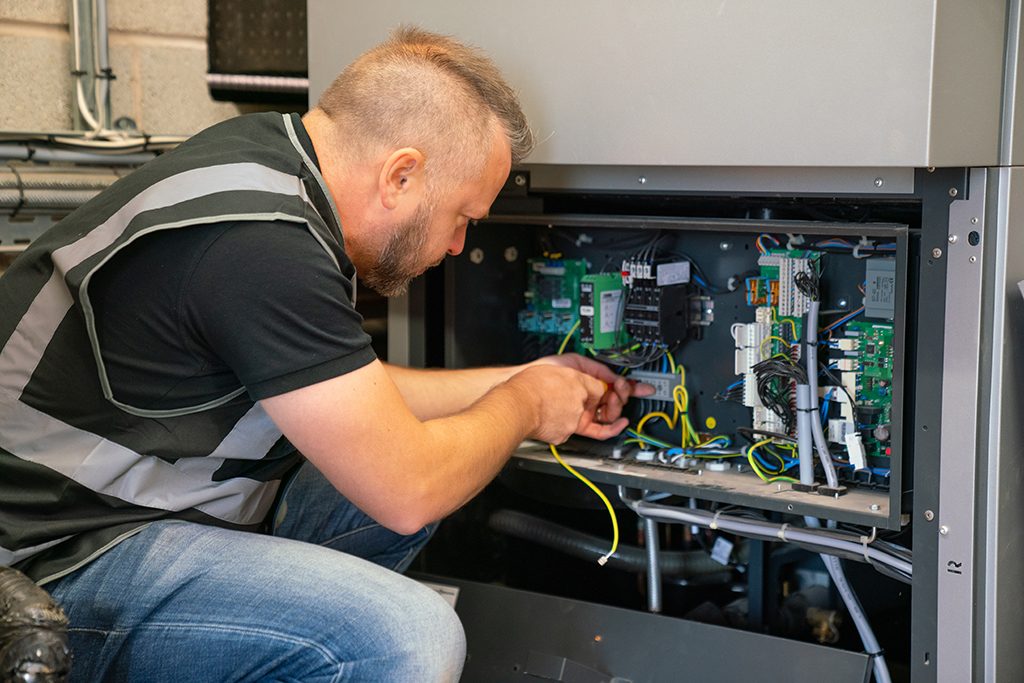 Installer working with electrics.
