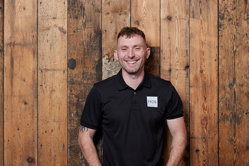 Installer smiling at camera.