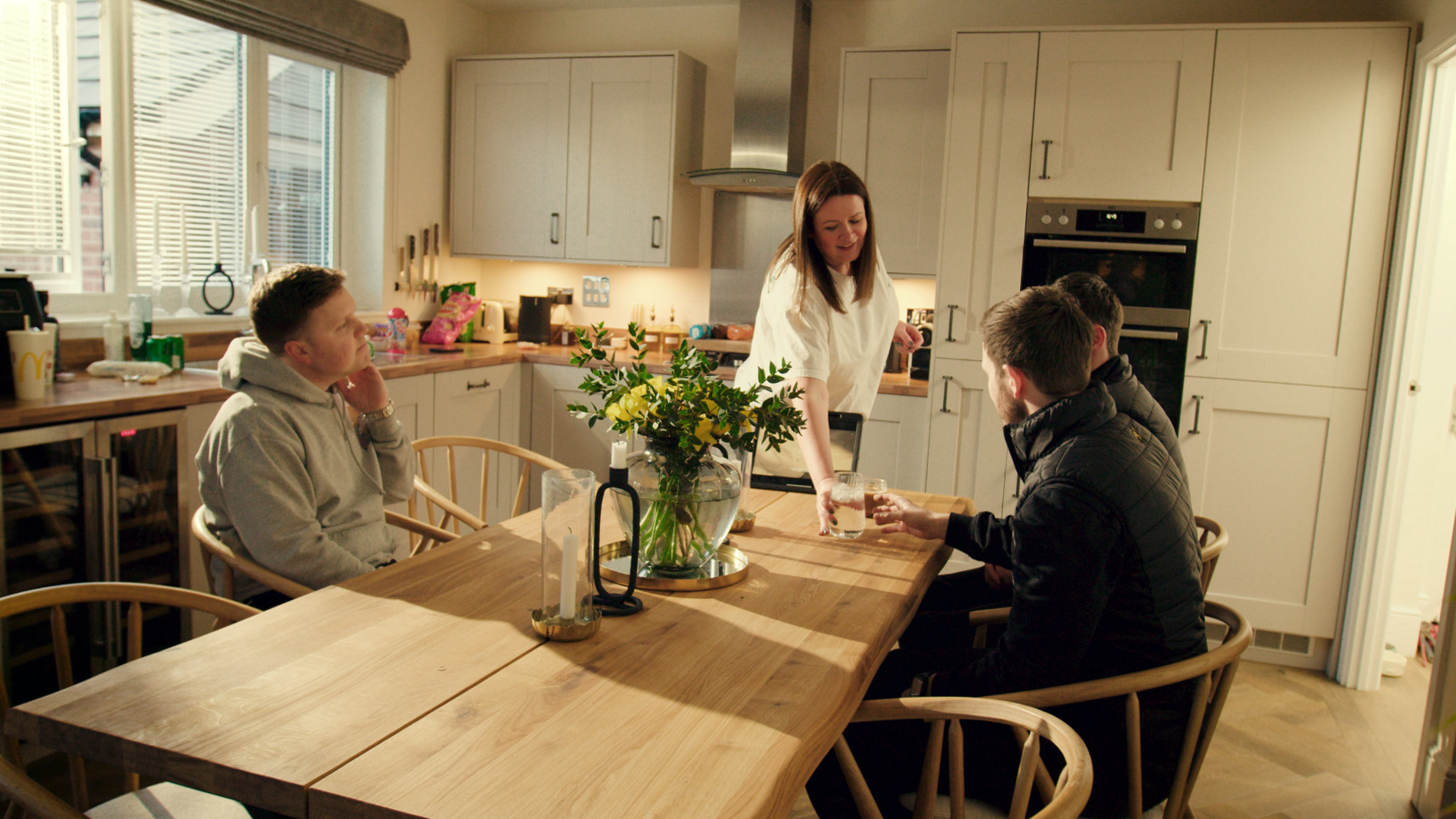 Installers in home sitting down with homeowners