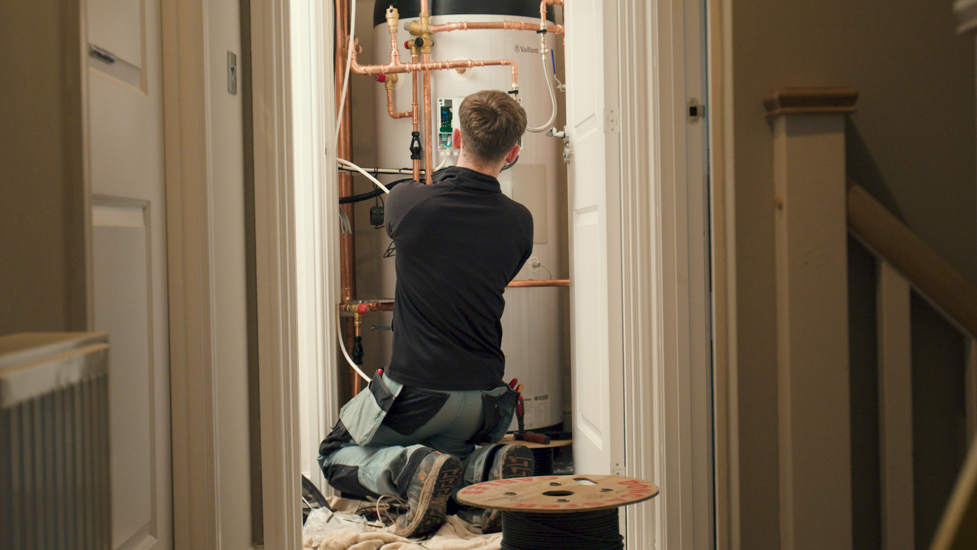 Installer fitting heat pump.