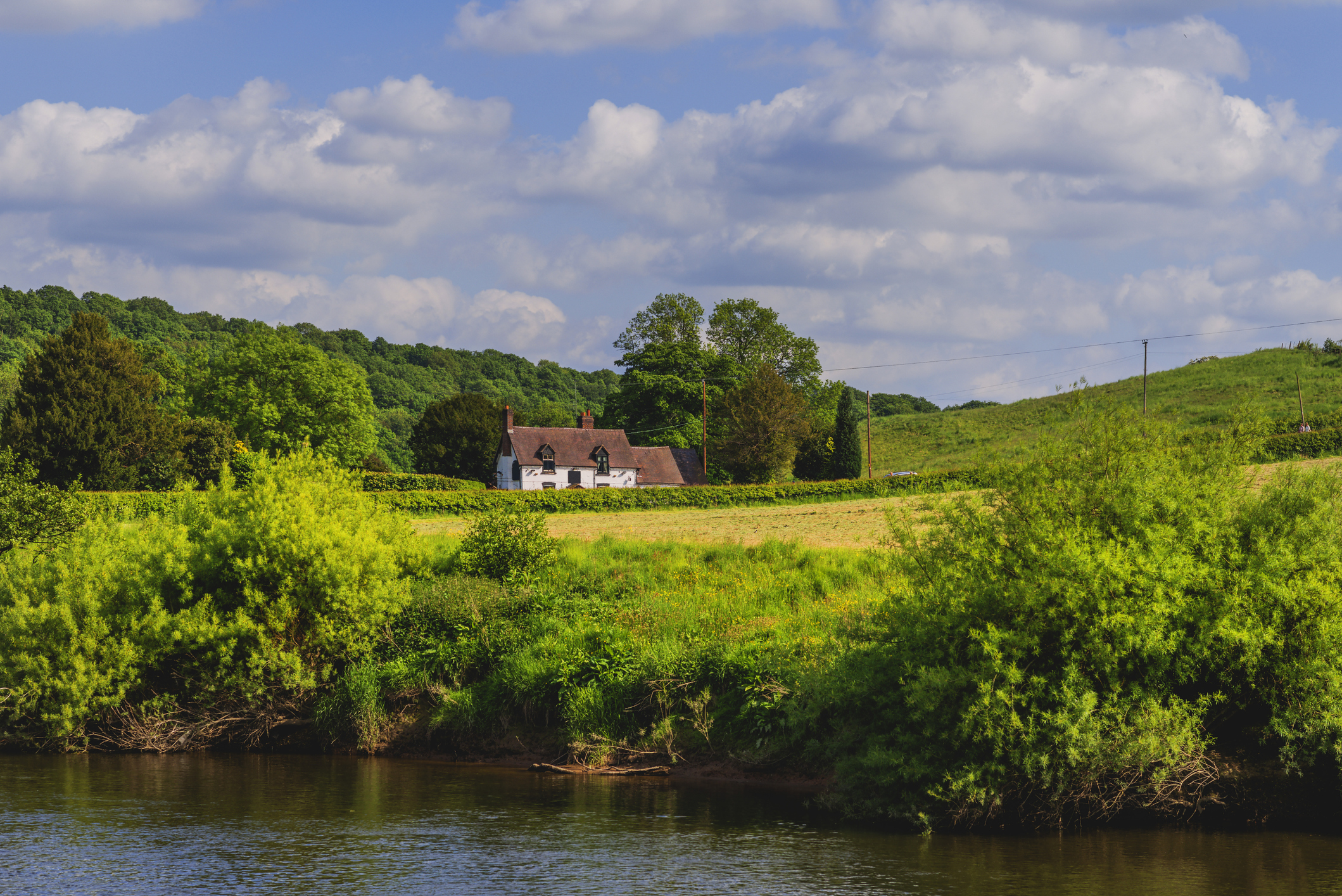 Rural landscape with cottage.