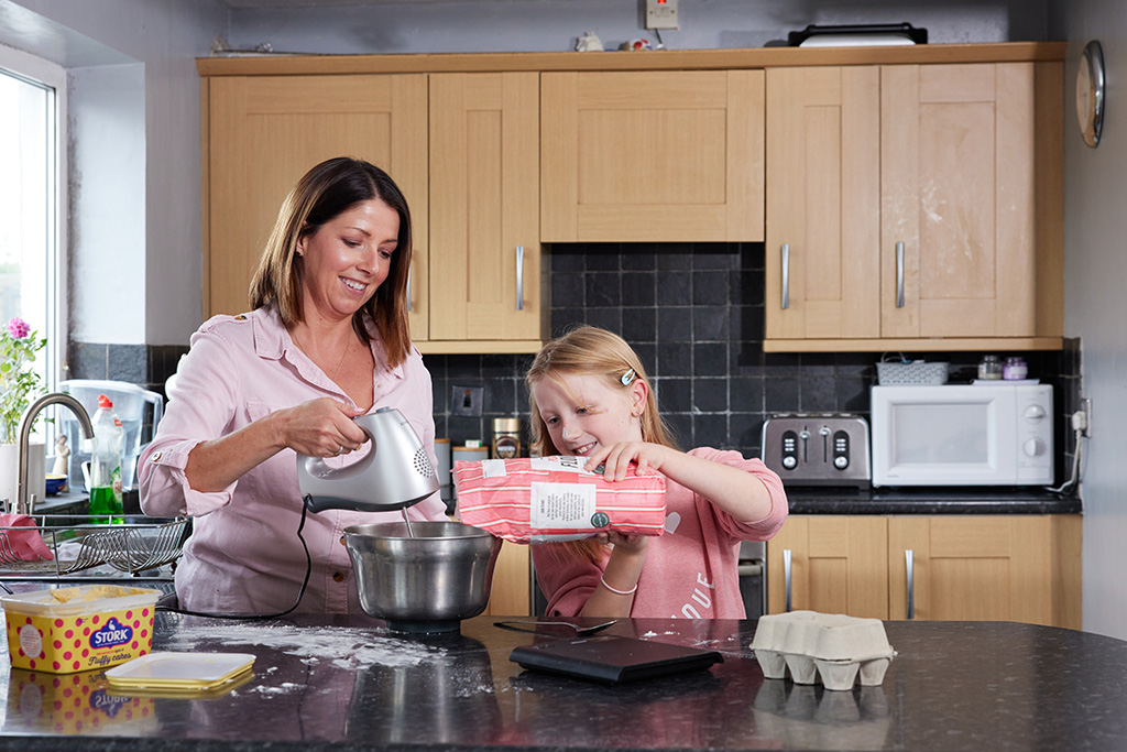 Mother and daughter baking