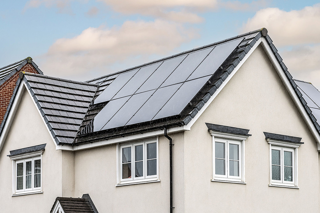 Solar panels on white house.