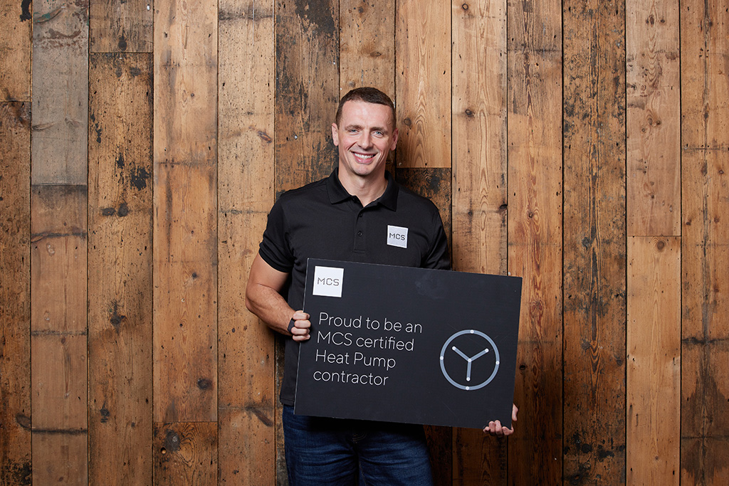 Installer holding sign.