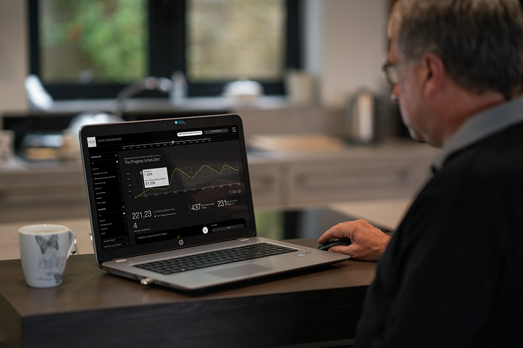 Man on laptop with the MCS Data Dashboard open.