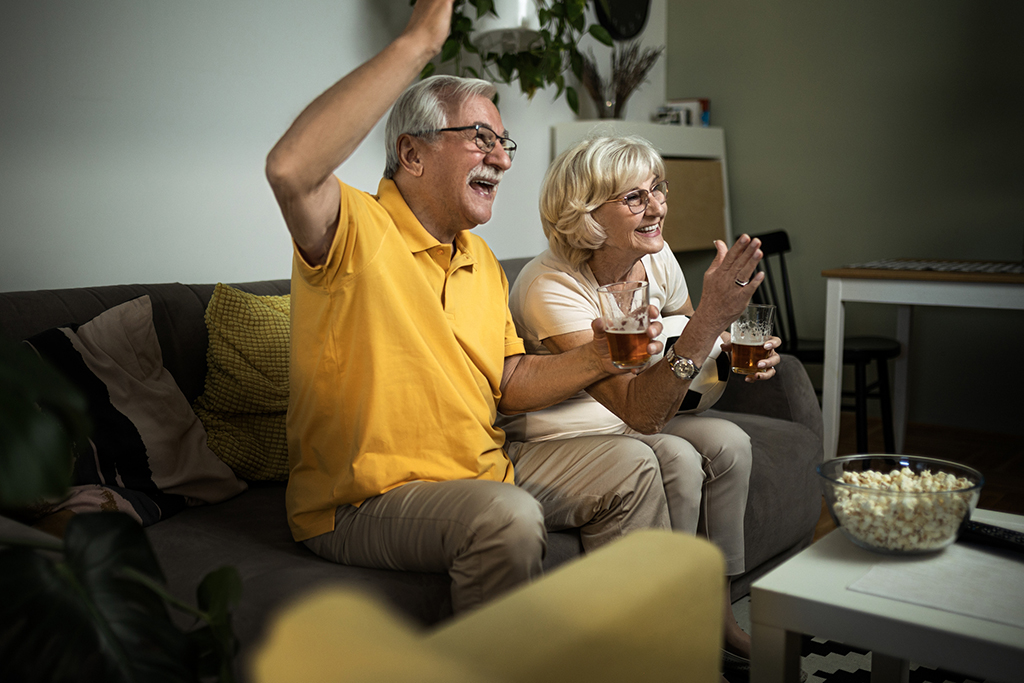 Couple watching Tv in living room