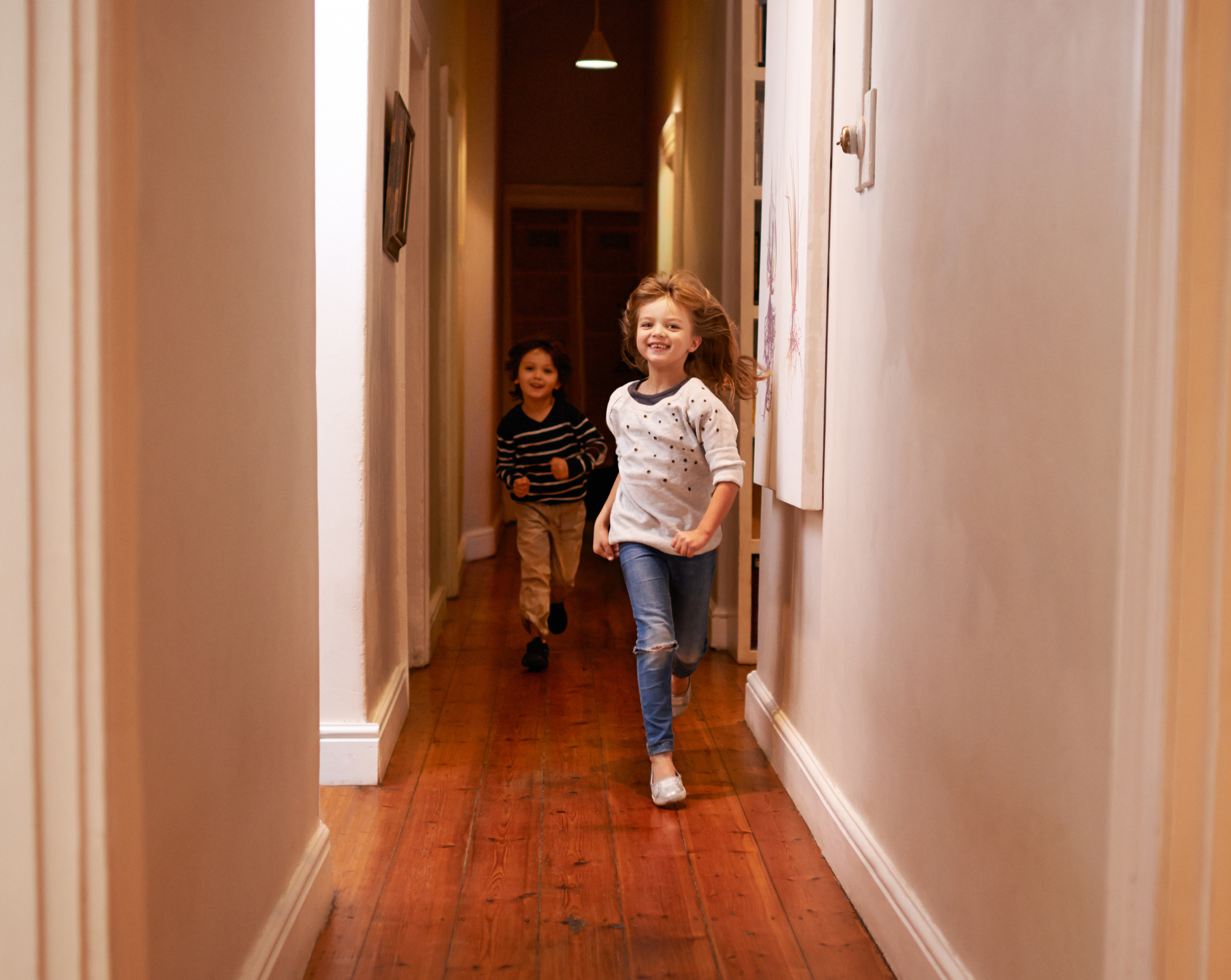 children running through hallway