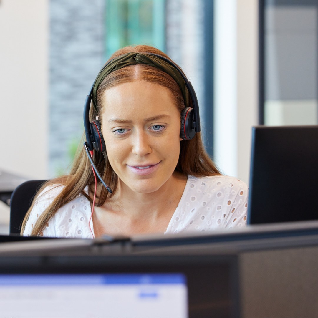woman with headset on.