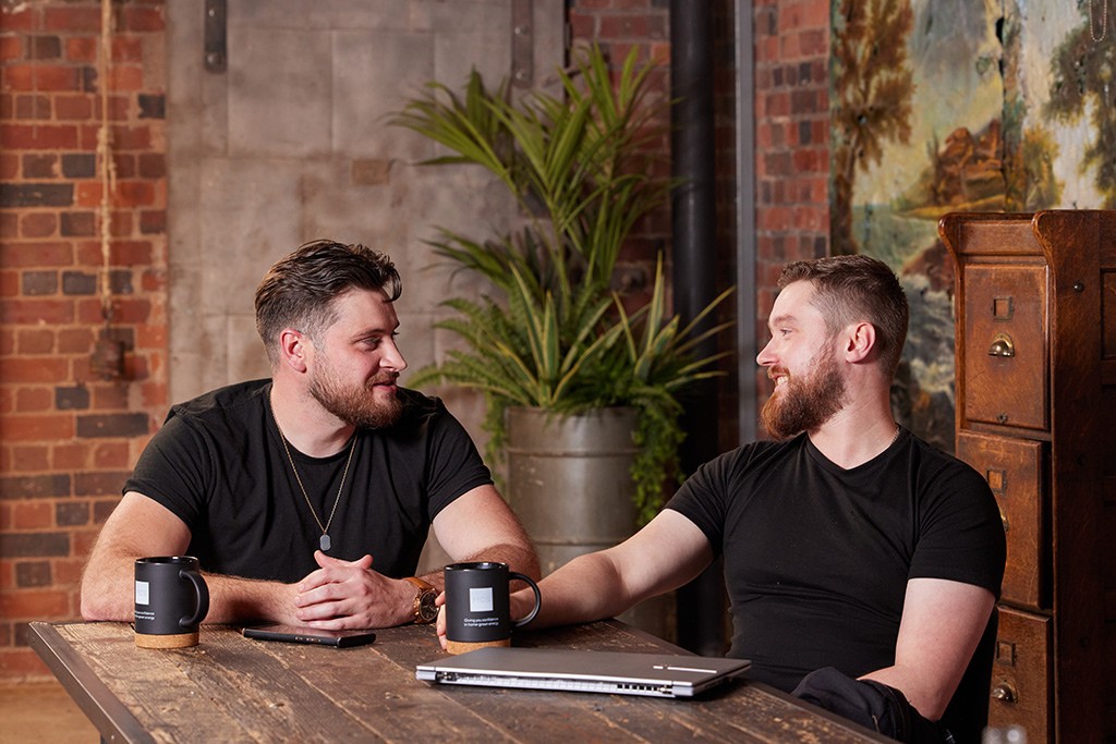 Installers sat at table talking.