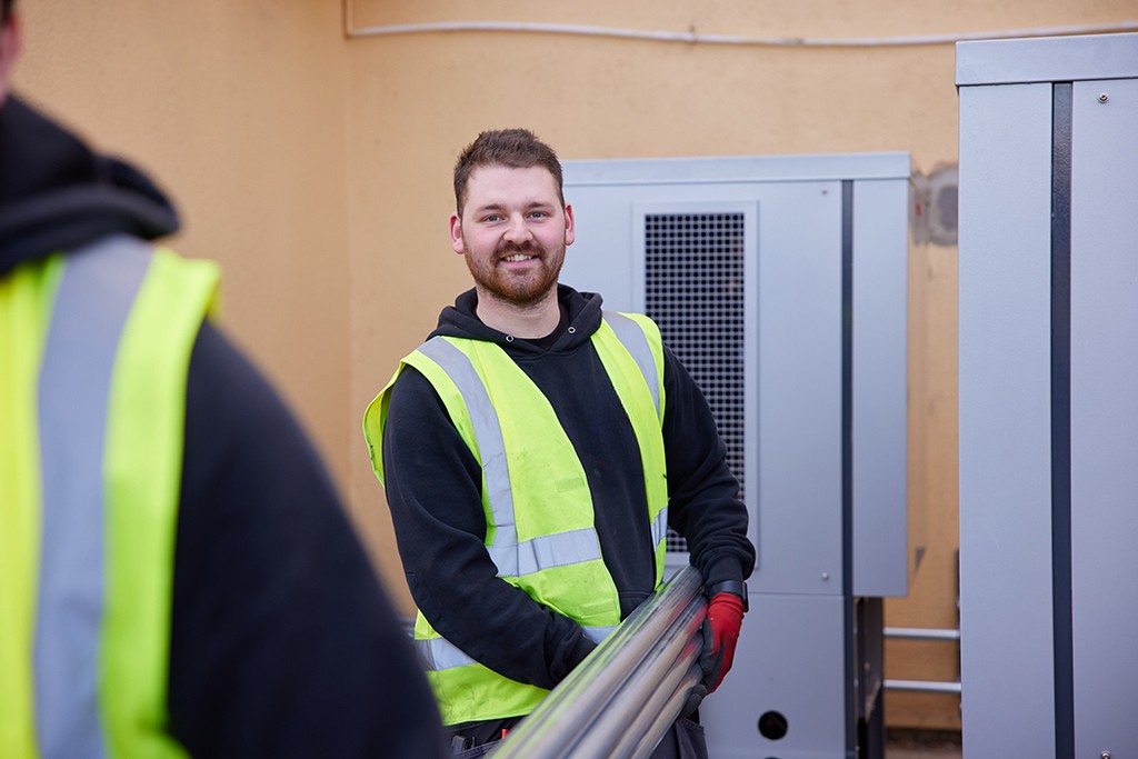 Installer carrying materials.