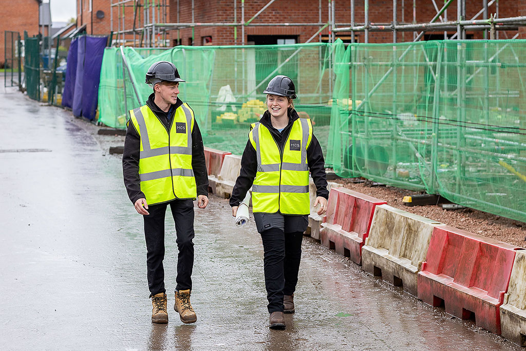 Installers walking on site.