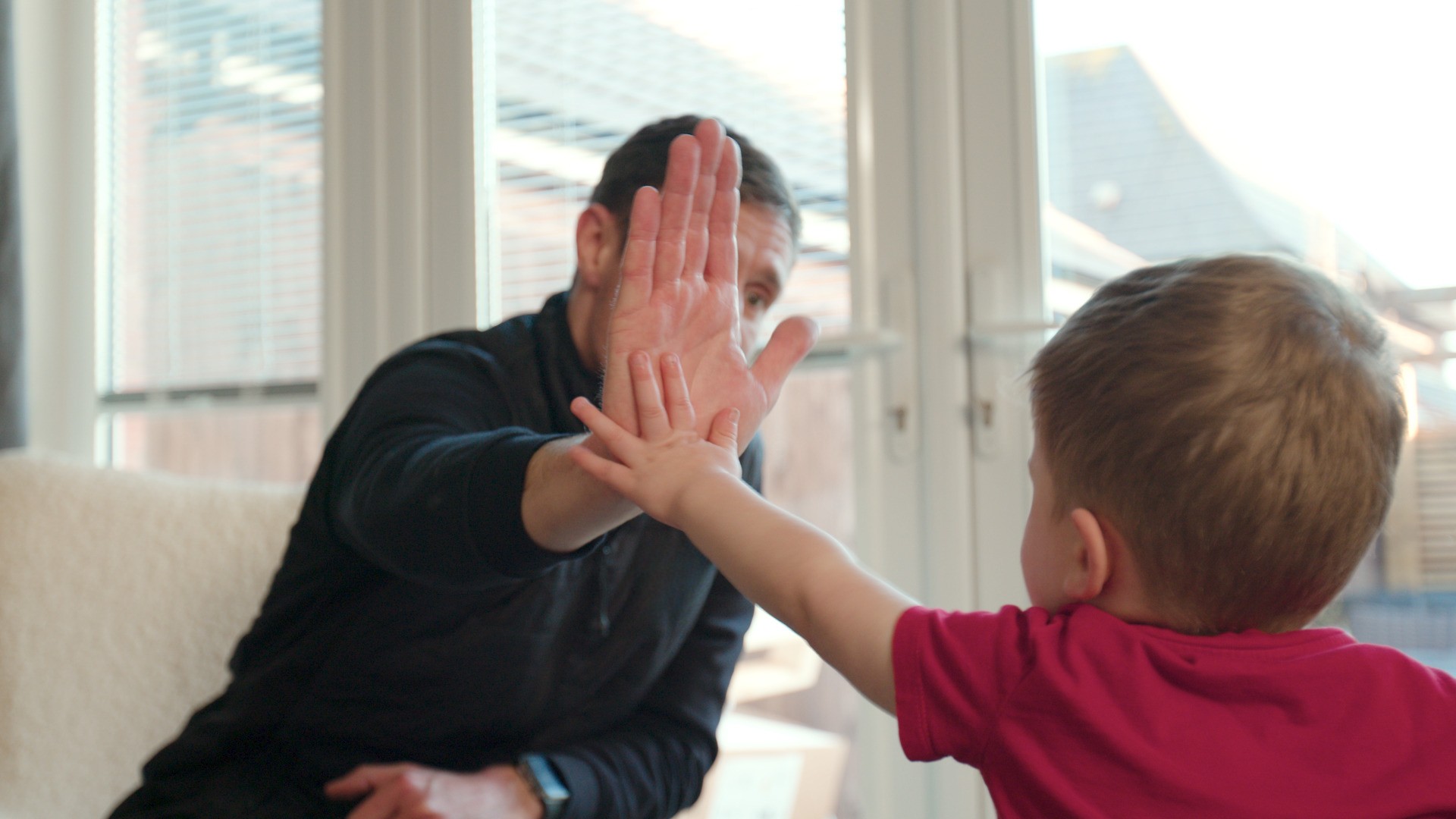 Installer hi fiving child.
