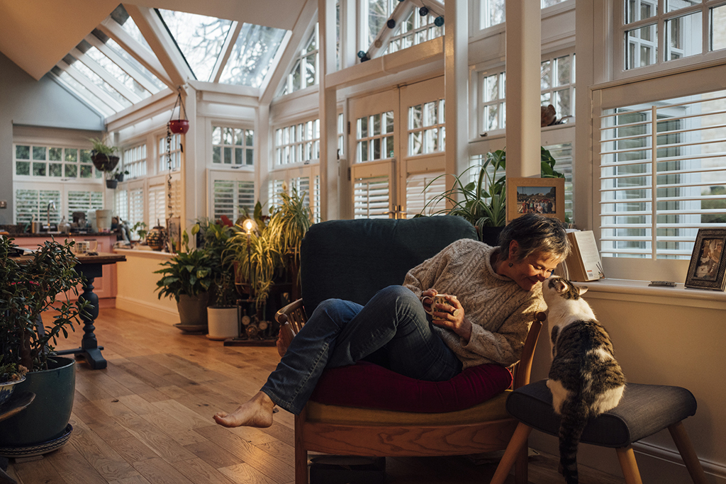 Woman sat with cat.