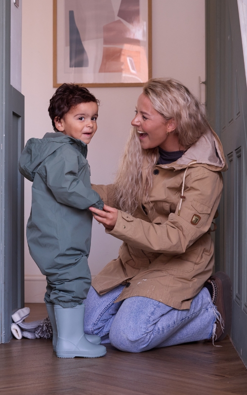 Mother and son at staircase.